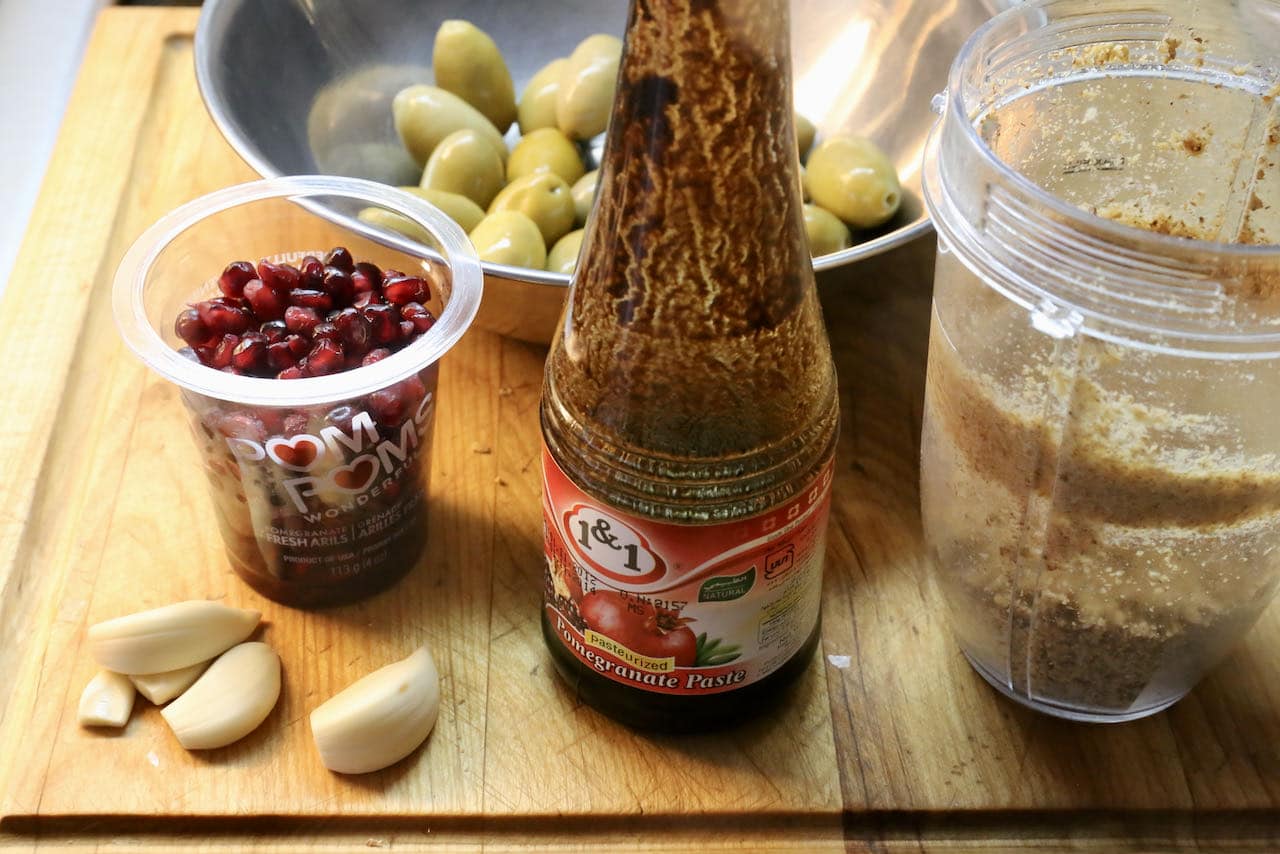 Zeytoon Parvardeh features green olives, walnuts, garlic, dried mint and pomegranate molasses.