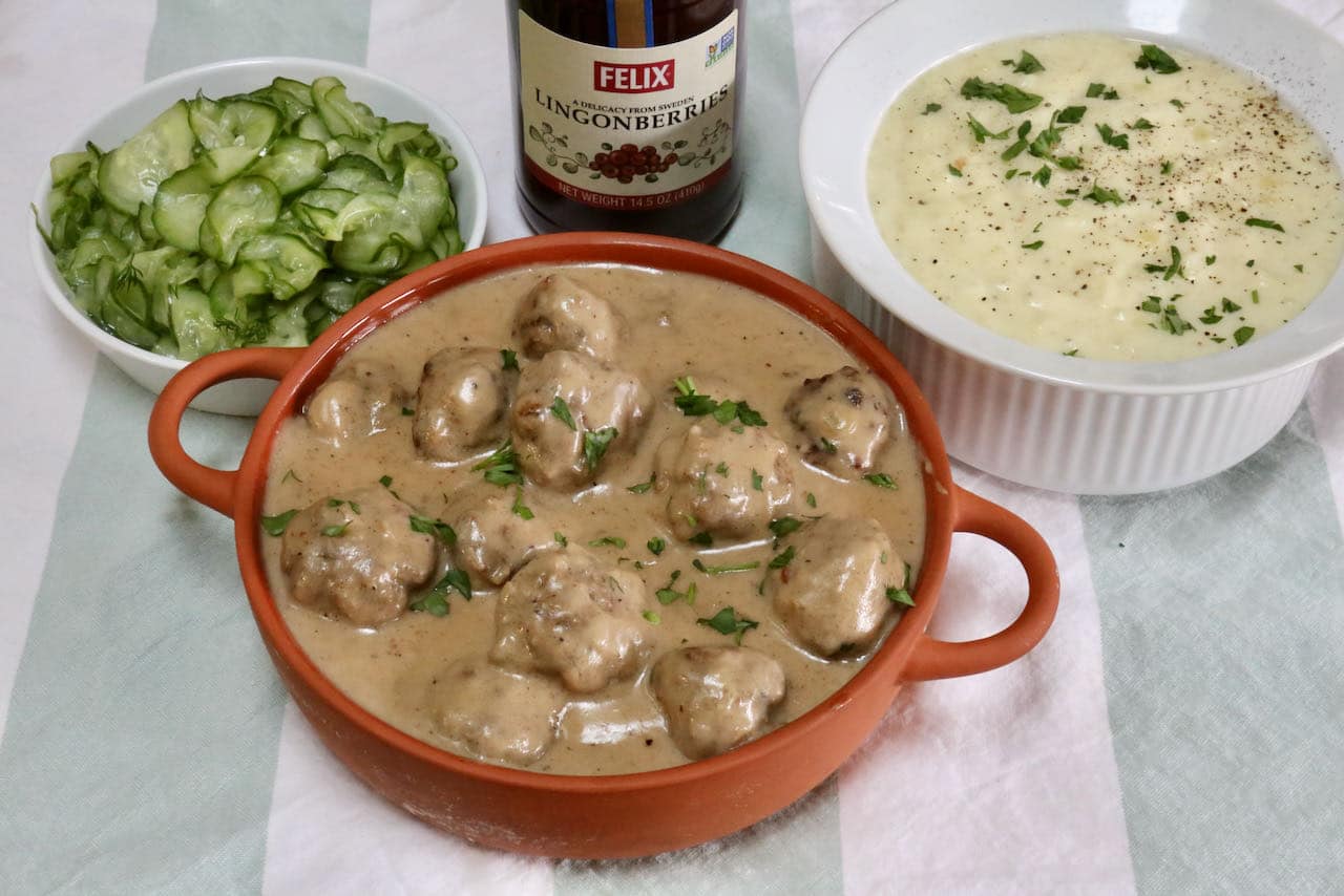 Serve traditional Köttbullar with mashed potatoes, lingonberry jam and quick pickled cucumbers.