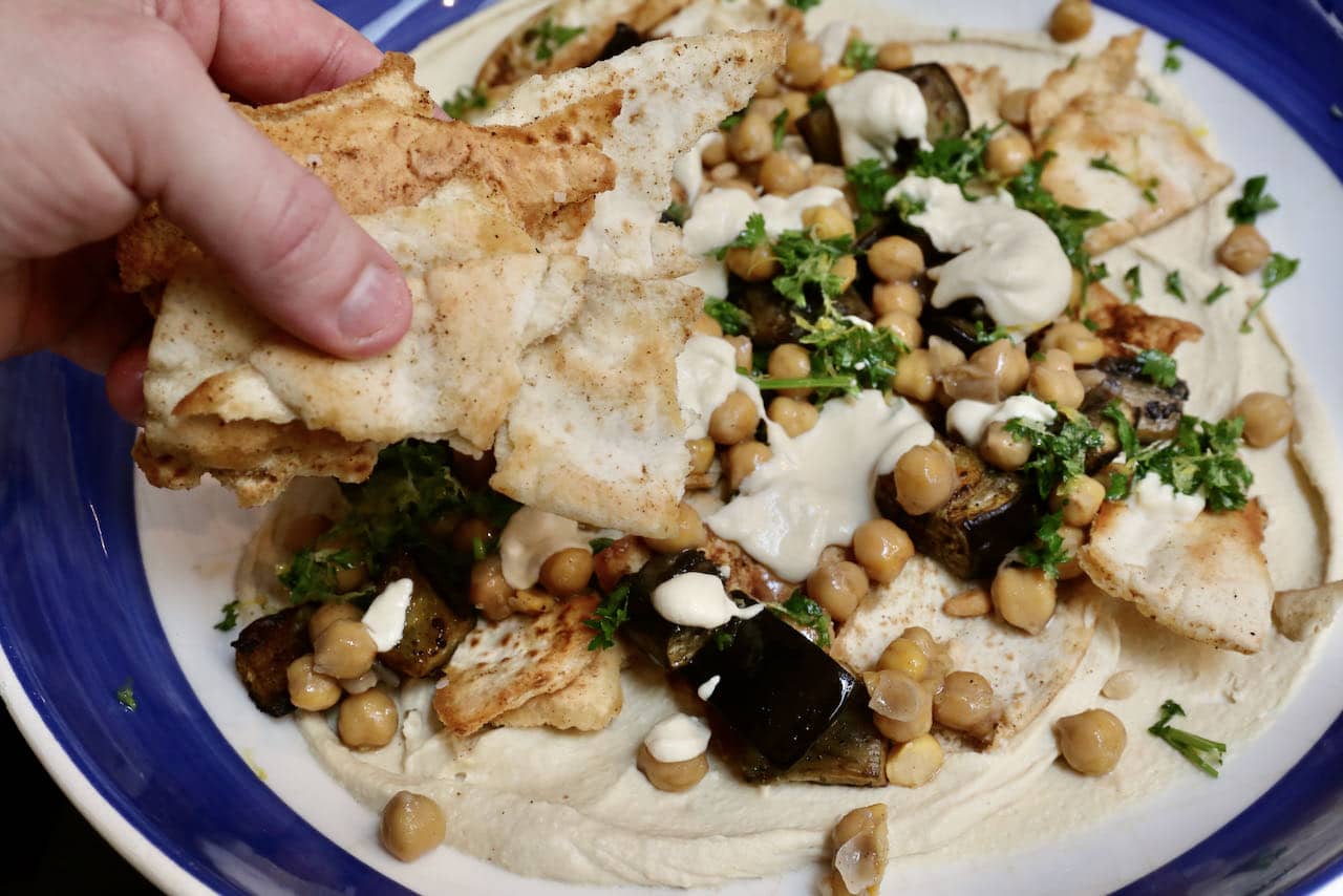 Eggplant Fatteh is a Lebanese salad featuring crunchy baked pita and soft chickpeas.