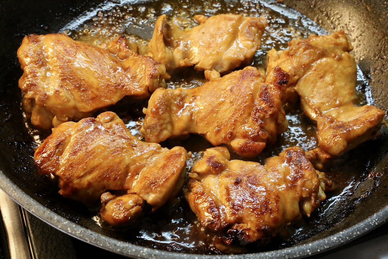 Stir fry ponzu chicken until crispy and browned.