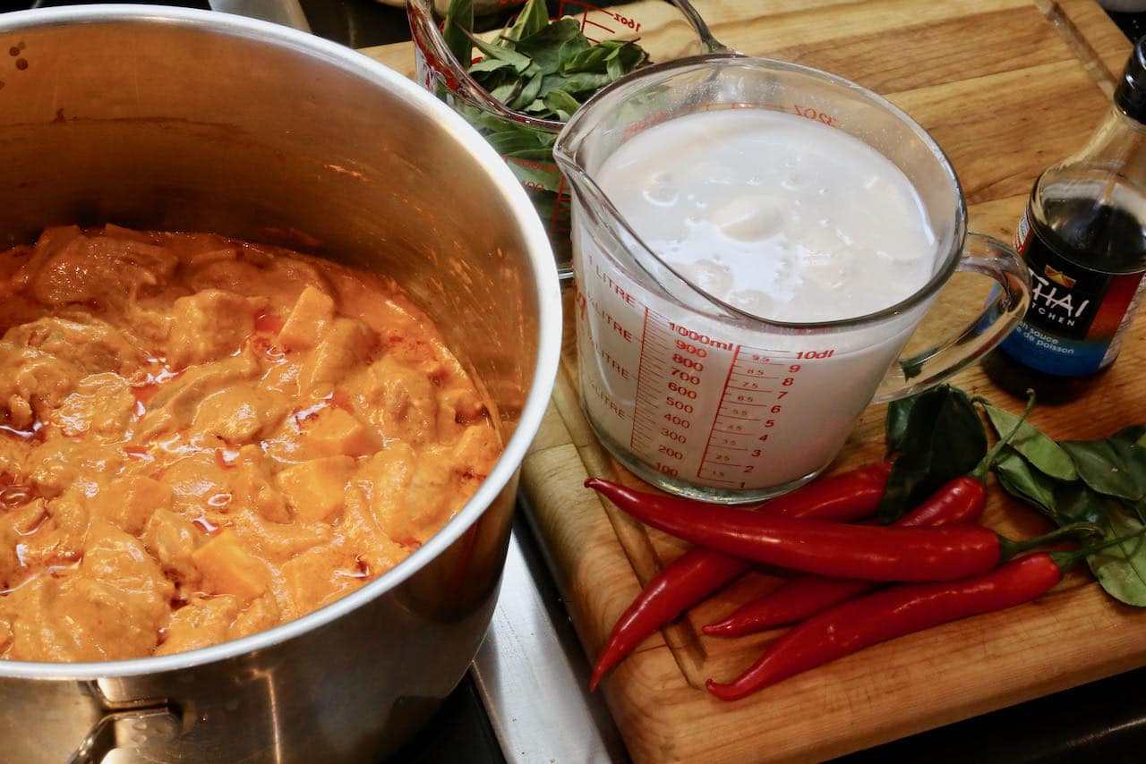 Prepare traditional Thai Pork Curry recipe in a large pot or dutch oven over your stove.