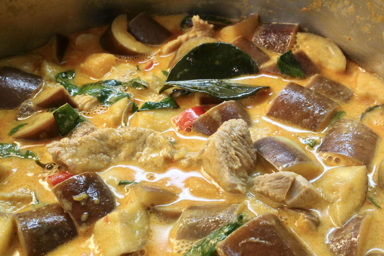 Creamy Red Thai Pork Curry features chunks of eggplant and butternut squash.