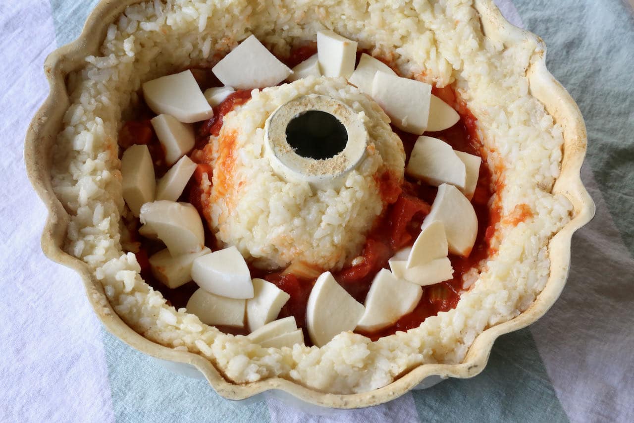 Fill bundt pan with risotto mixture and stuff with tomato sauce and mozzarella cheese.