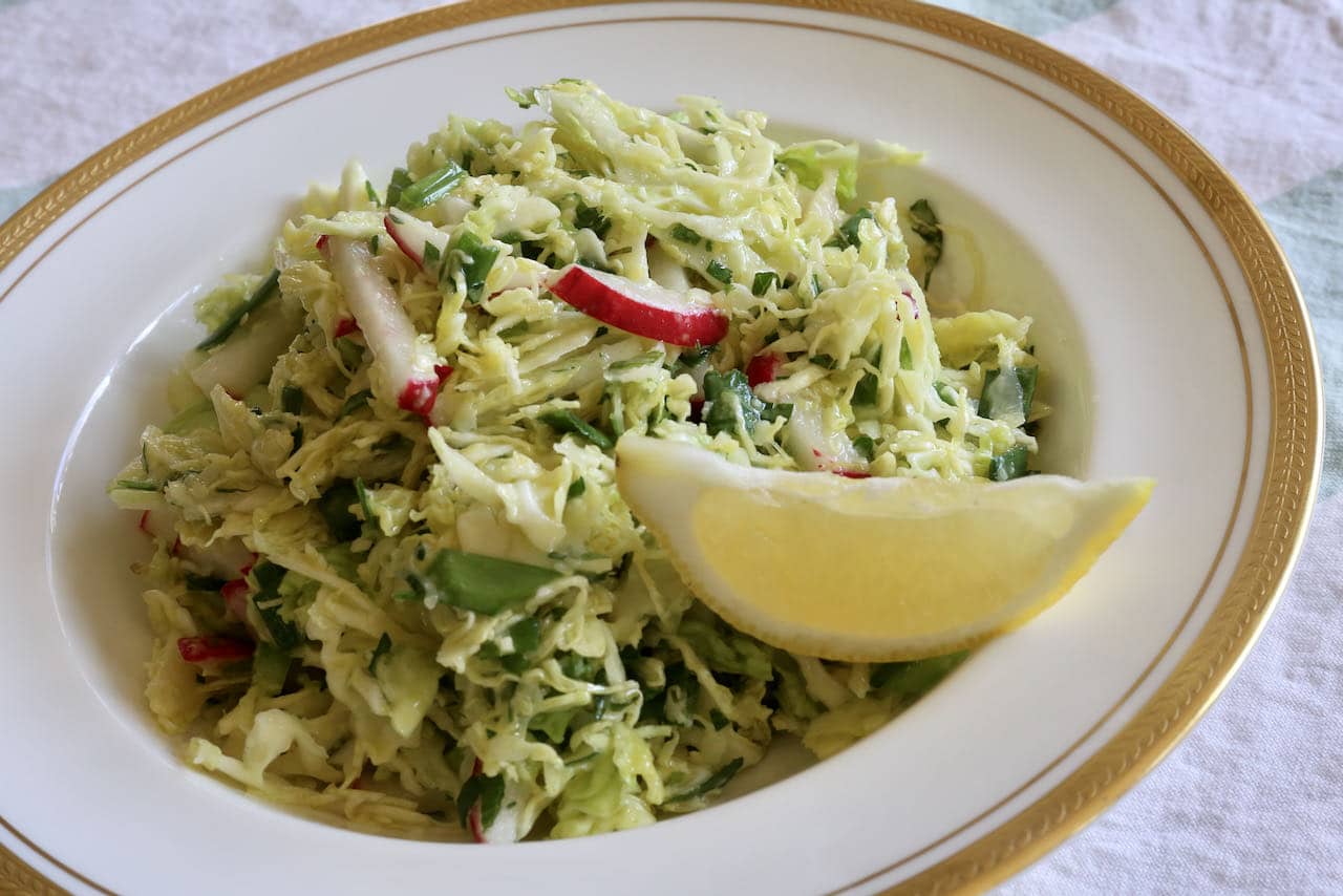 Serve Lebanese Cabbage Salad with the spritz of a lemon slice. 
