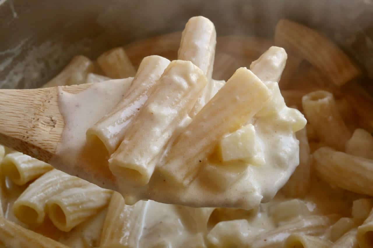 Älplermagronen is a Swiss pasta dish featuring macaroni and diced potato tossed in Gruyere cheese cream sauce.