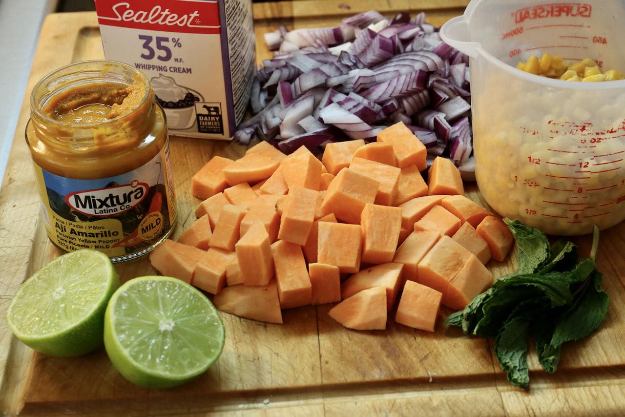 Chupe de Quinoa features Aji Amarillo paste, cream, onion, sweet potatoes, corn, lime and mint. 