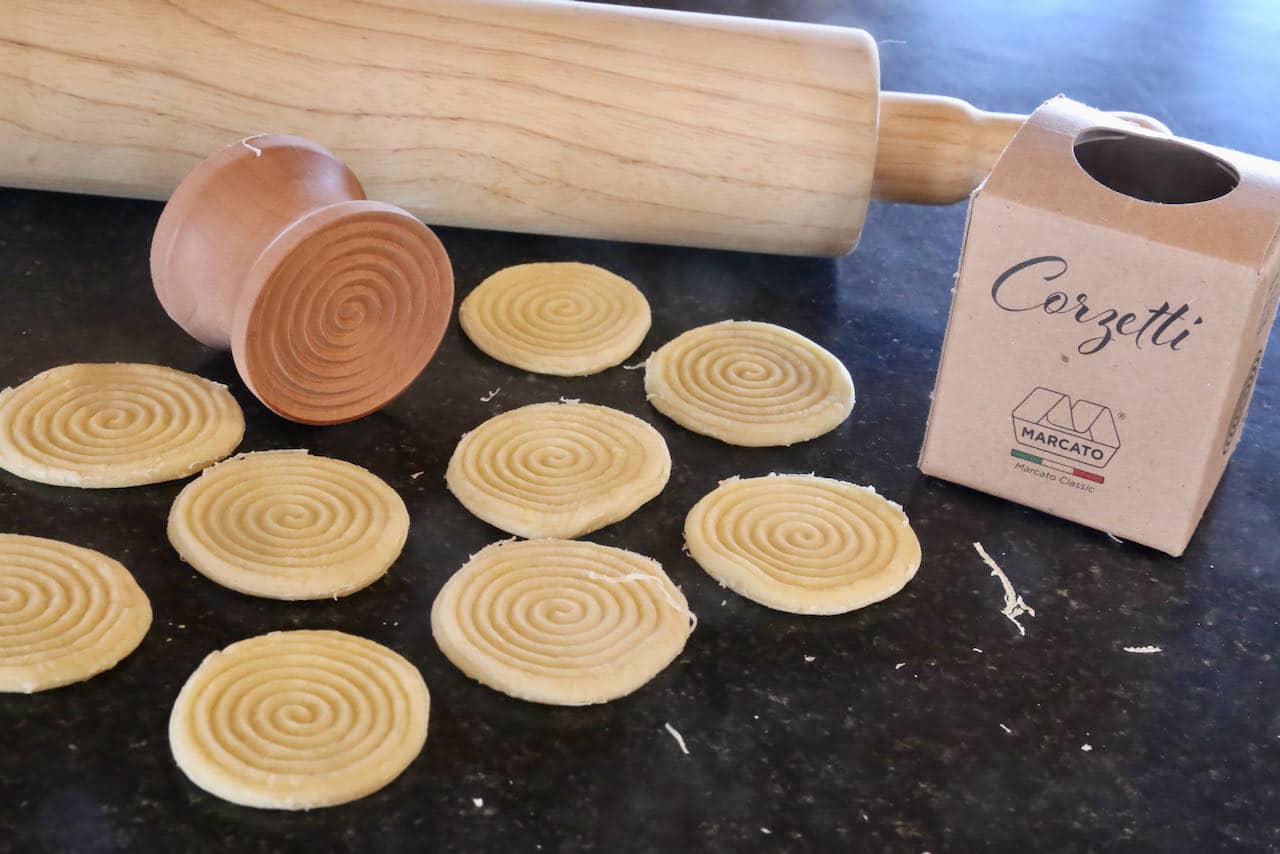 This fresh pasta is prepared with a "Corzetti stamp," which imprints the dough with a unique design.