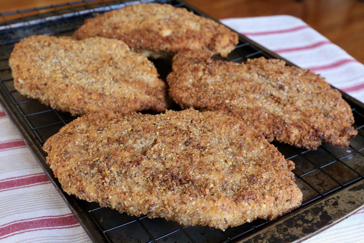 Let crispy Dukkah Chicken Breasts rest on a rack before slicing.