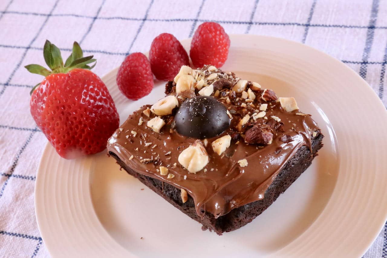 Pair a slice of decadent Lindt Chocolate Cake with fresh strawberries and raspberries. 