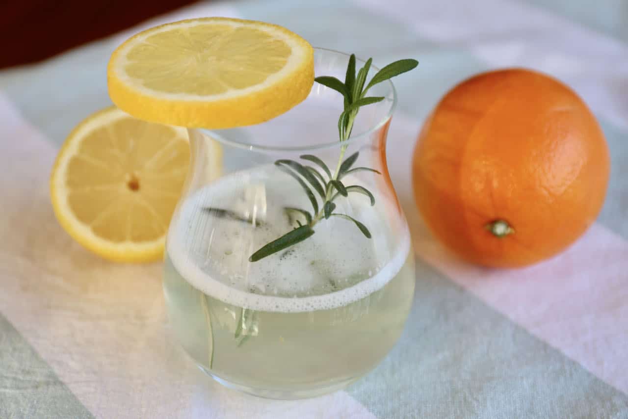Garnish your Gin and Milk with a slice of fresh lemon and rosemary sprig. 