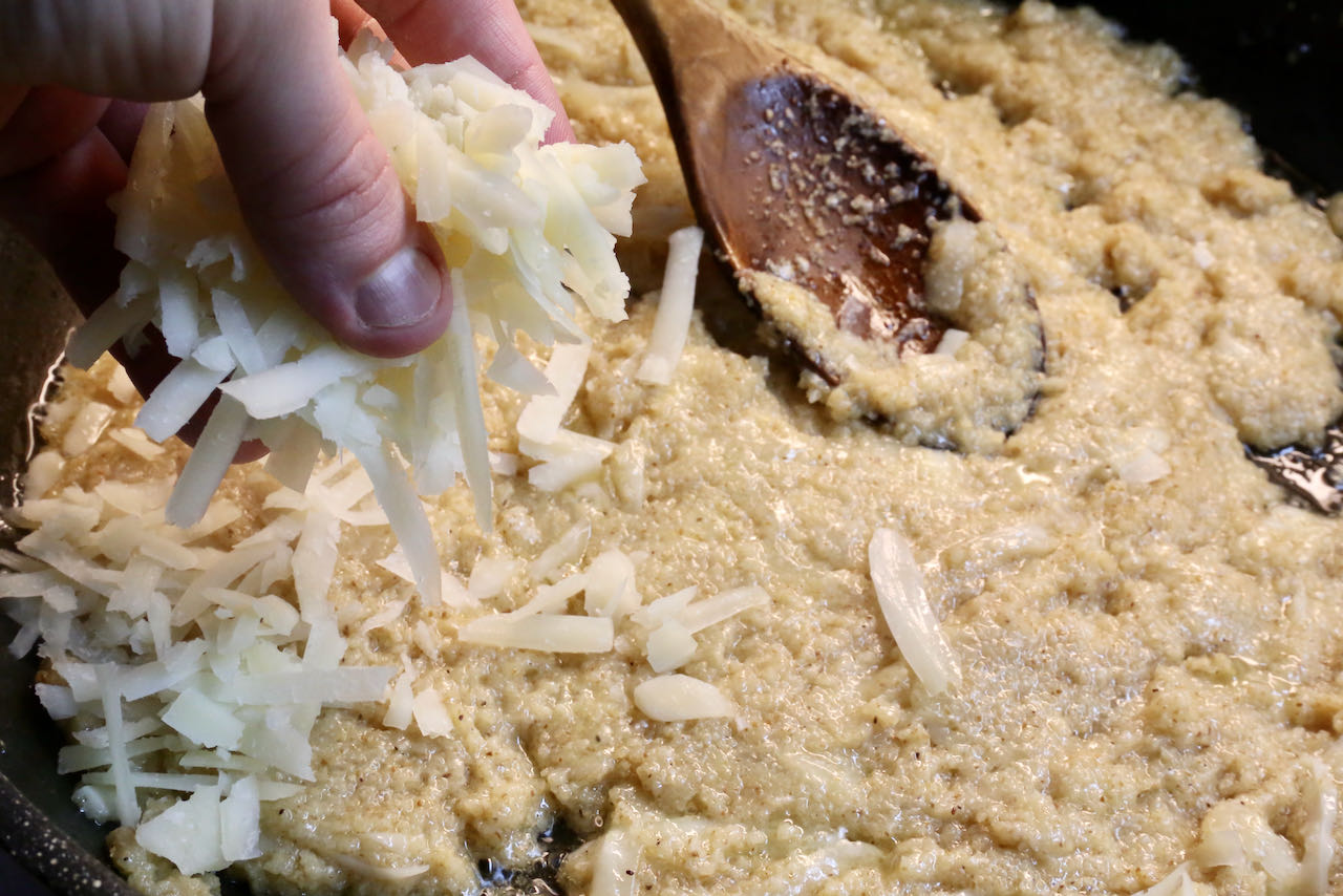 Kuymak Mihlama is prepared in a skillet or copper pot on the stove by toasting cornmeal and adding shredded Turkish cheese.