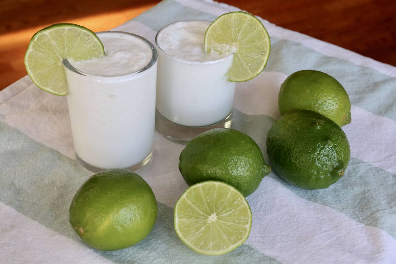 Serve Limonada de Coco with a fresh lime wheel. 