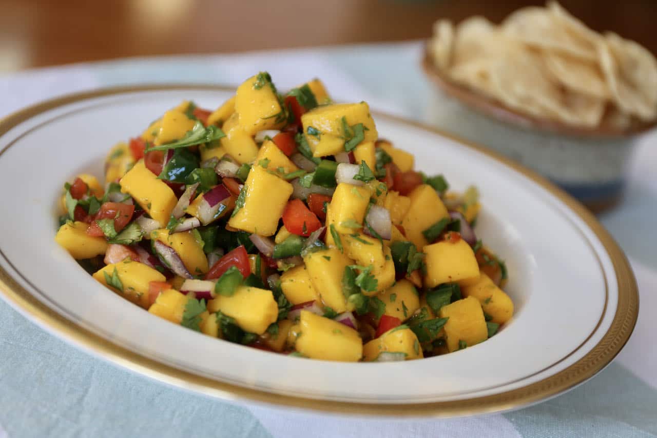 Serve Mango Pico de Gallo with nachos, guacamole and salsa. 
