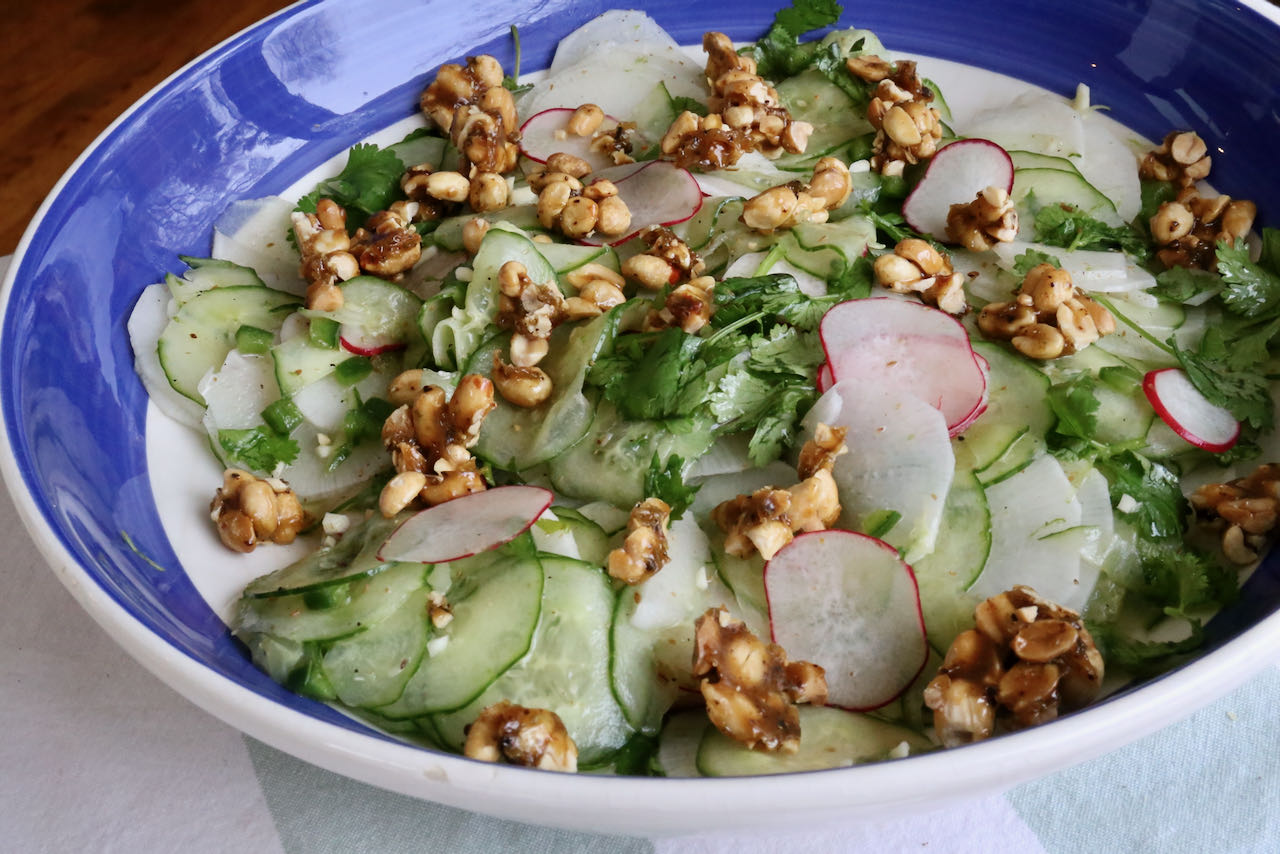 Vegan Cucumber Salad is garnished with spicy chipotle peanut brittle. 