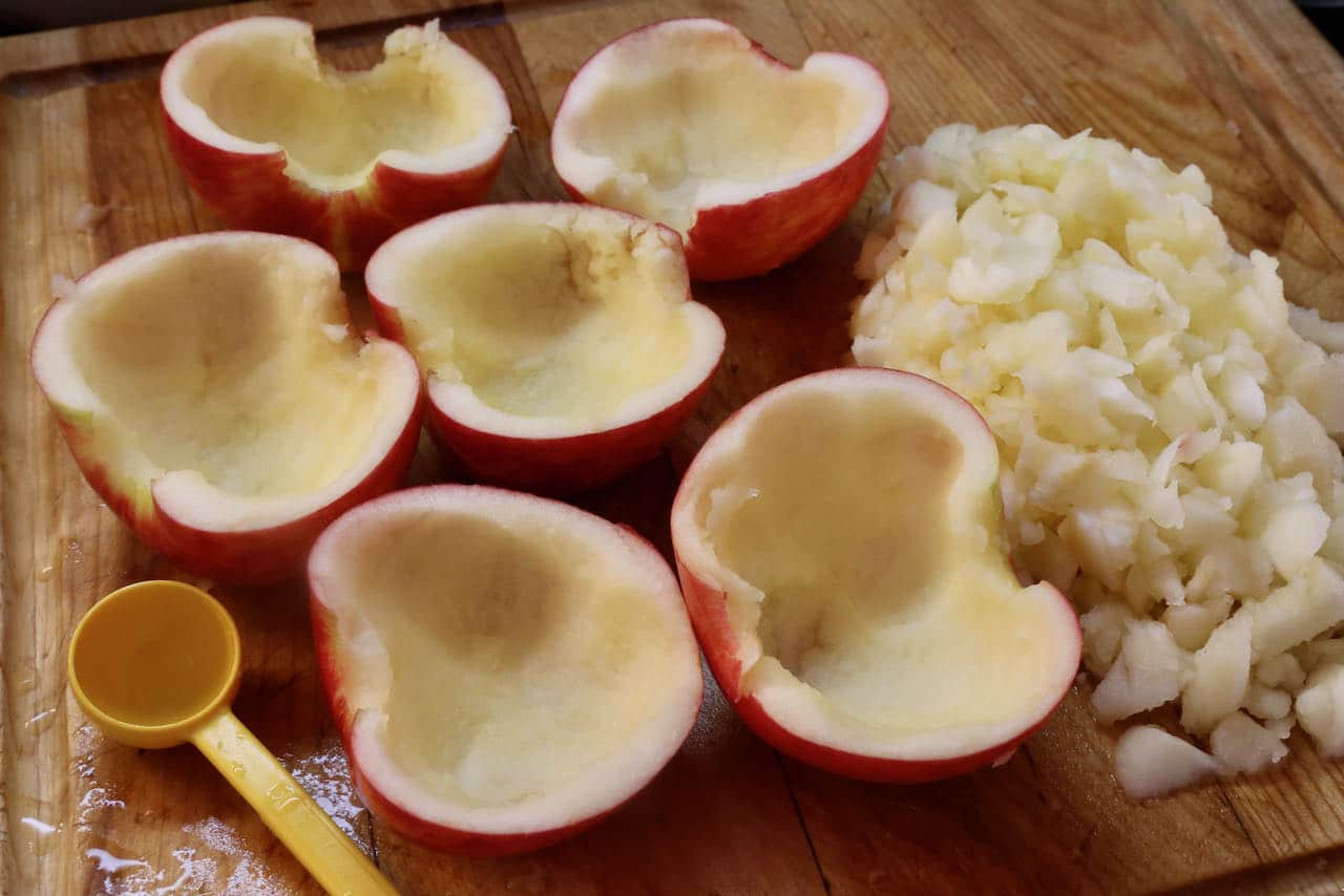 Sausage Stuffed Apples Recipe: Use a melon baller to to remove the interior fruit of each apple. 
