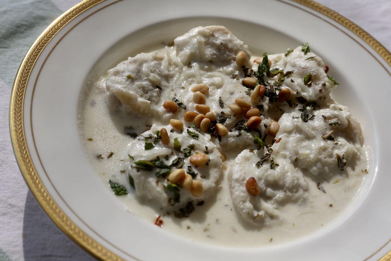 Serve Shish Barak Lamb Dumplings with fresh mint and toasted pine nuts.
