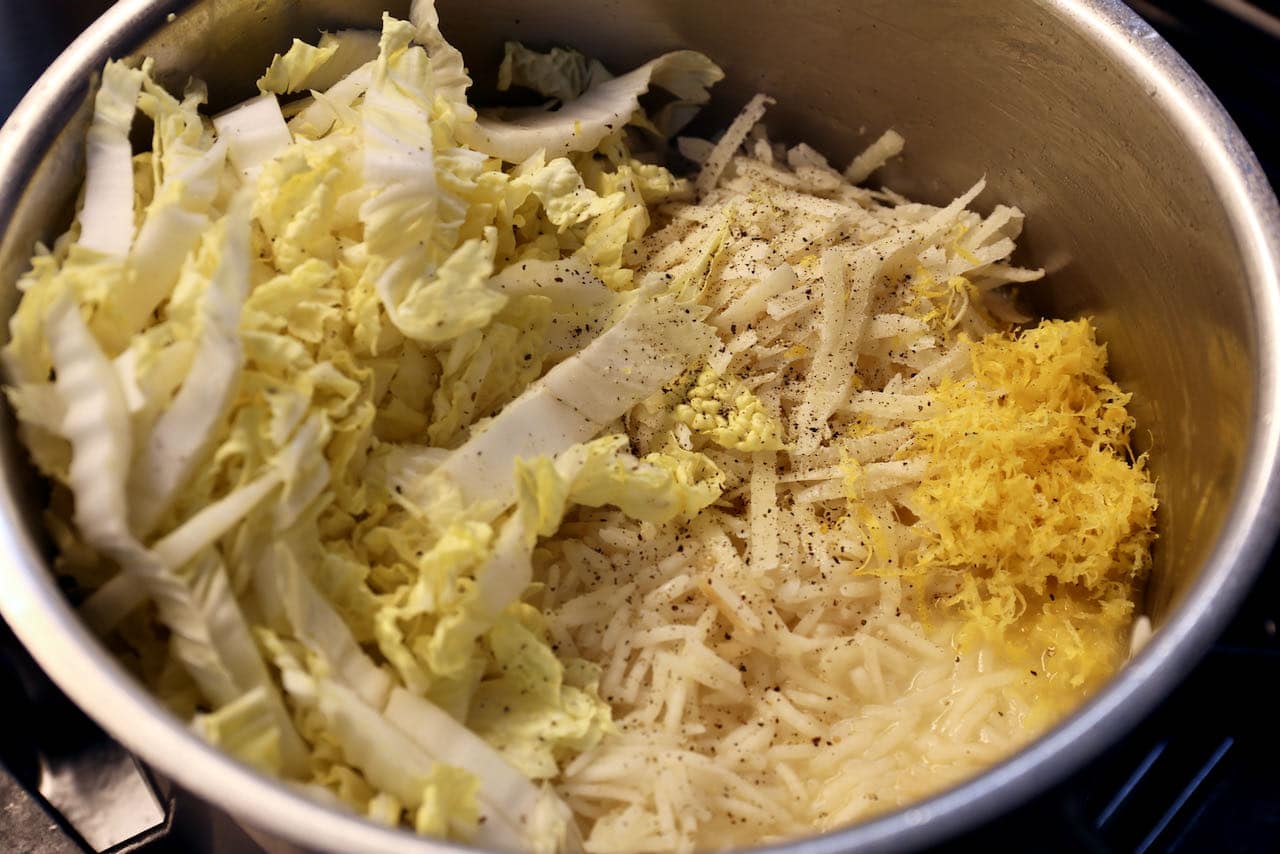 Stir cabbage and lemon zest into cooked rice and broth. 
