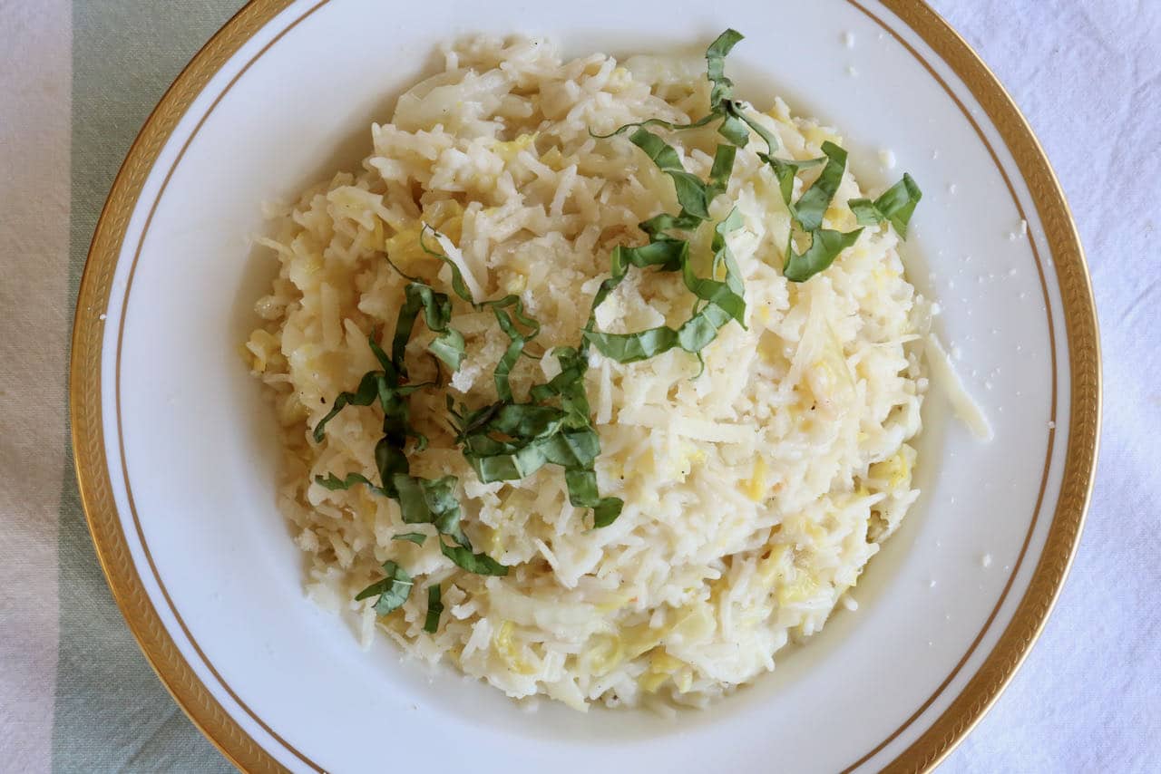 Garnish Cabbage and Rice with shredded parmesan cheese and sliced basil.