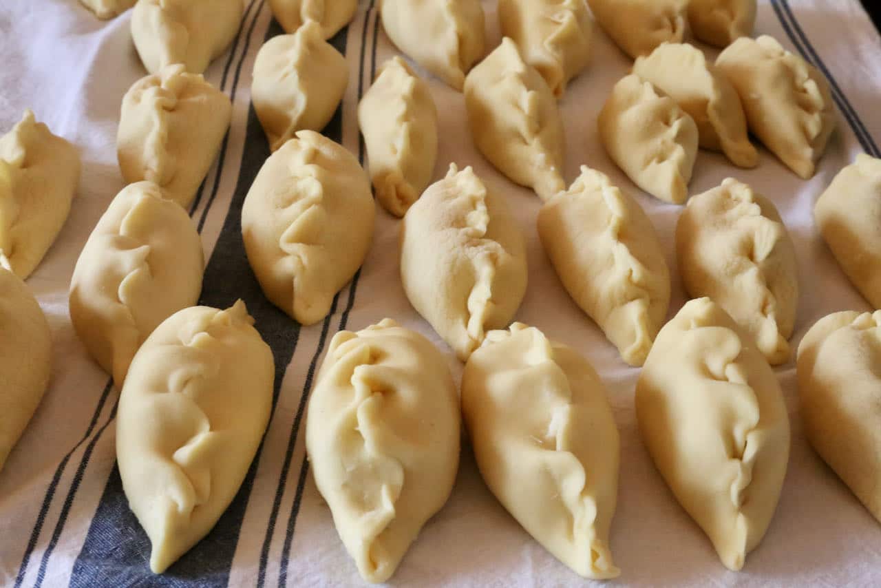 Seal Culurgiones by tightly pinching the Sardinian pasta dumplings. 