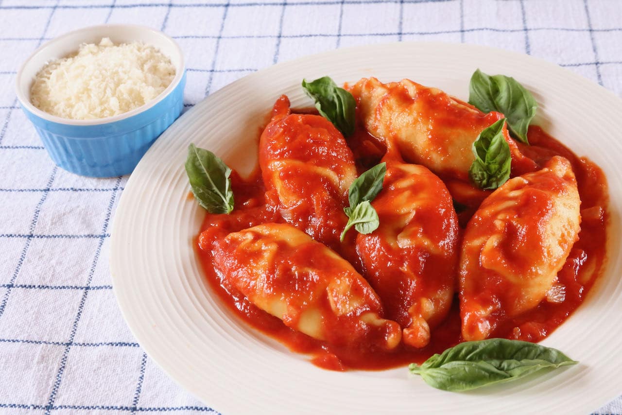 Traditional Culurgiones are tossed in tomato sauce with fresh basil and parmesan cheese.