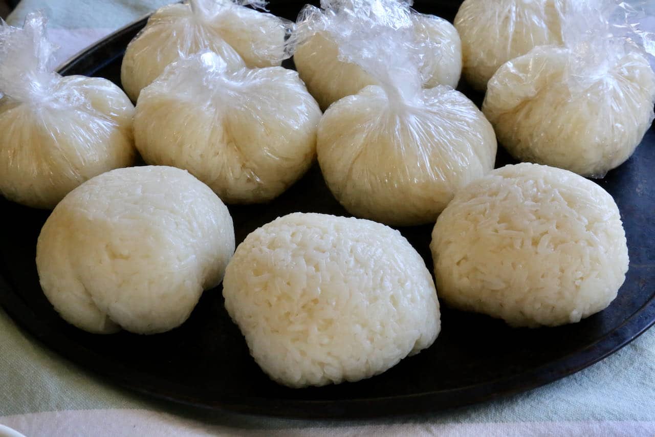 Form the Glutinous Rice Balls by wrapping them tightly with plastic wrap.