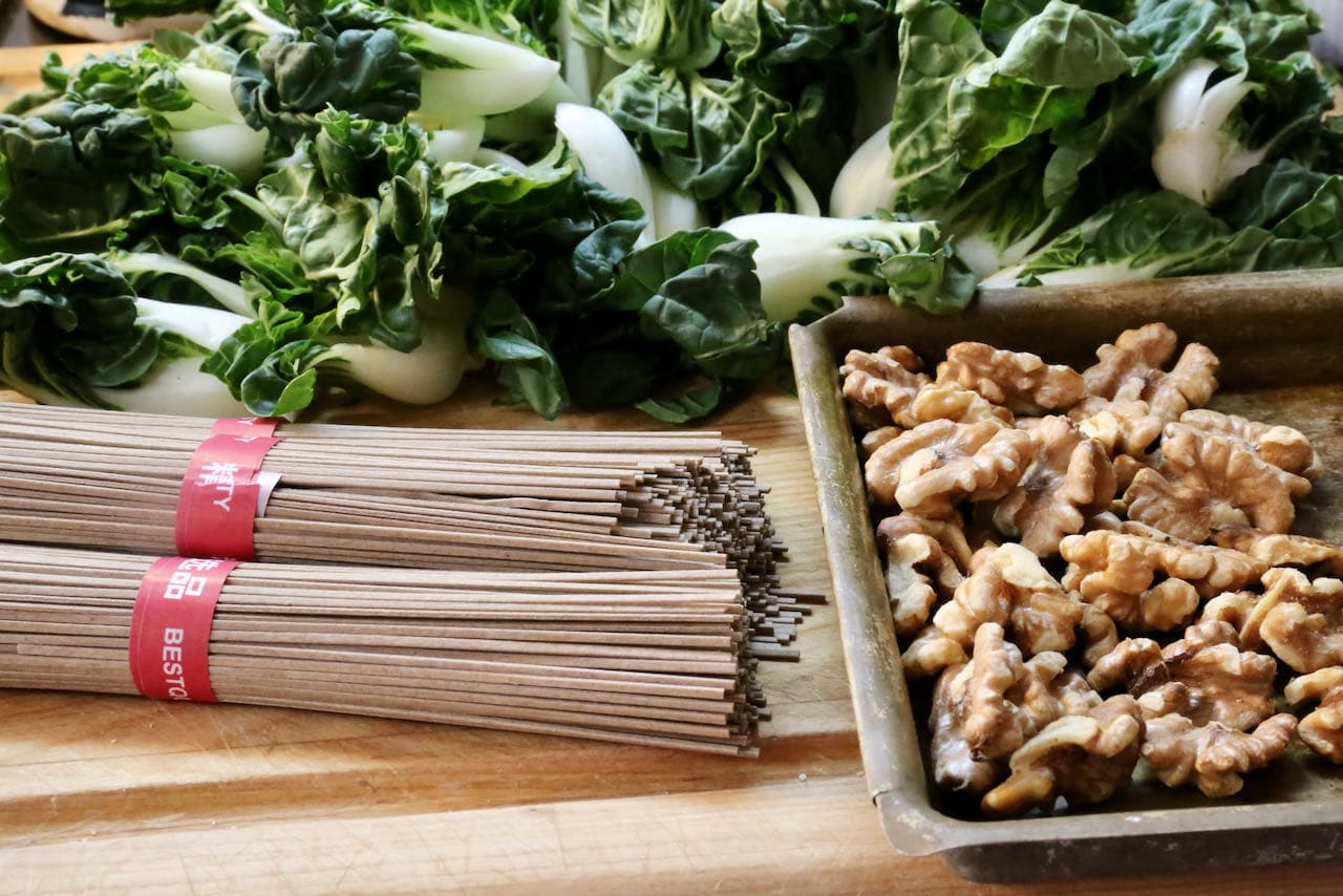 Our healthy Miso Noodles recipe features buckwheat soba, toasted walnut and bok choy. 