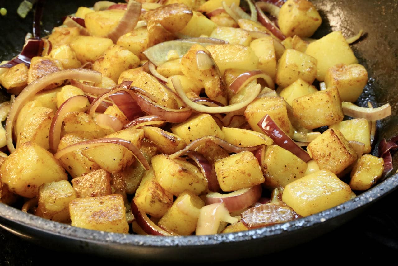 Cook Indian Turmeric Potatoes in a nonstick skillet until crispy and cooked through.