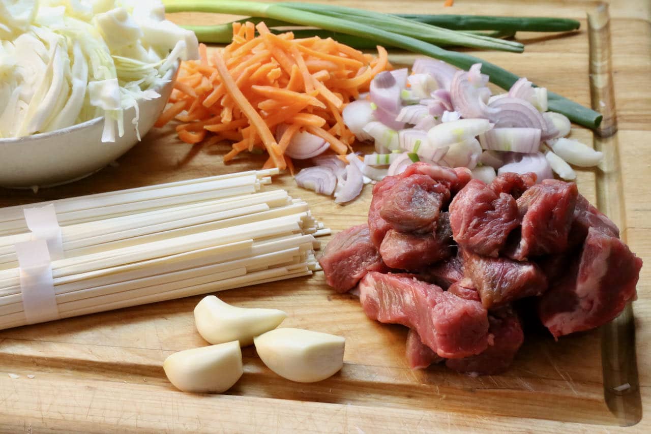 Authentic Beef Yaki Udon features Japanese noodles, garlic, cabbage, carrots, shallots and scallions.