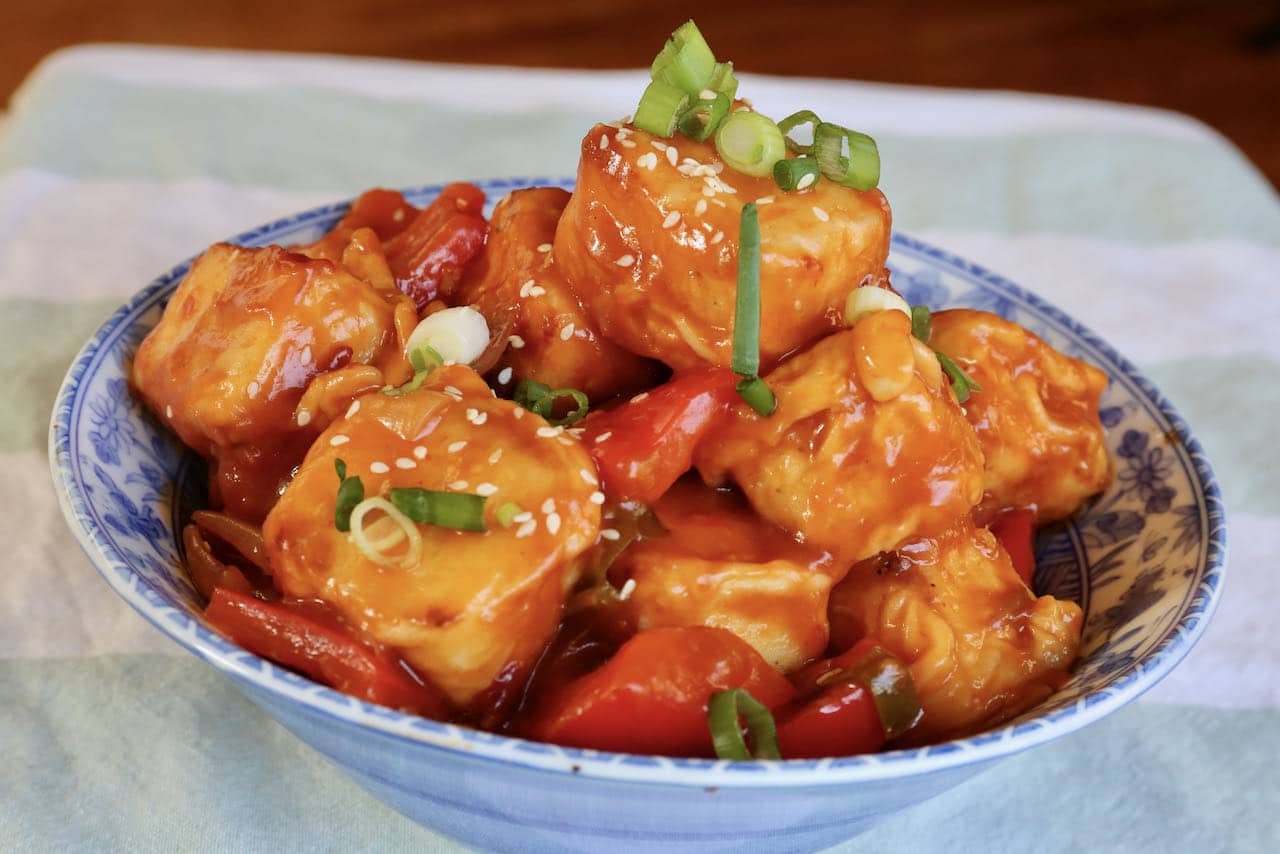 Serve Chilli Paneer Masala with sesame seeds and sliced scallions.
