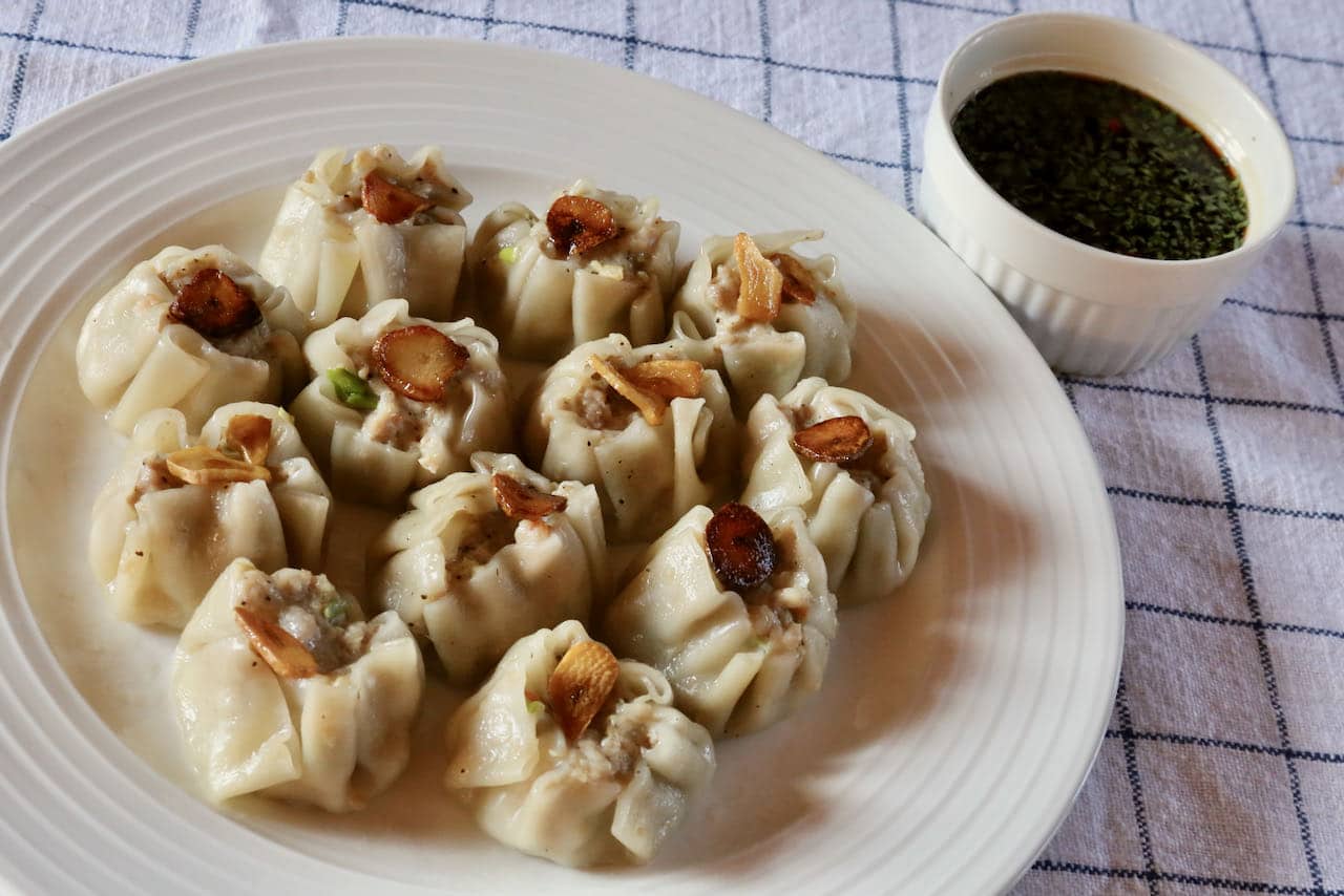 Serve Thai Dumplings with garlic chips and homemade dipping sauce. 