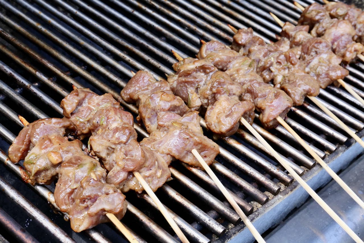 Flip Thai Pork Skewers on both sides in a very hot barbecue until both sides are crispy and cooked through.