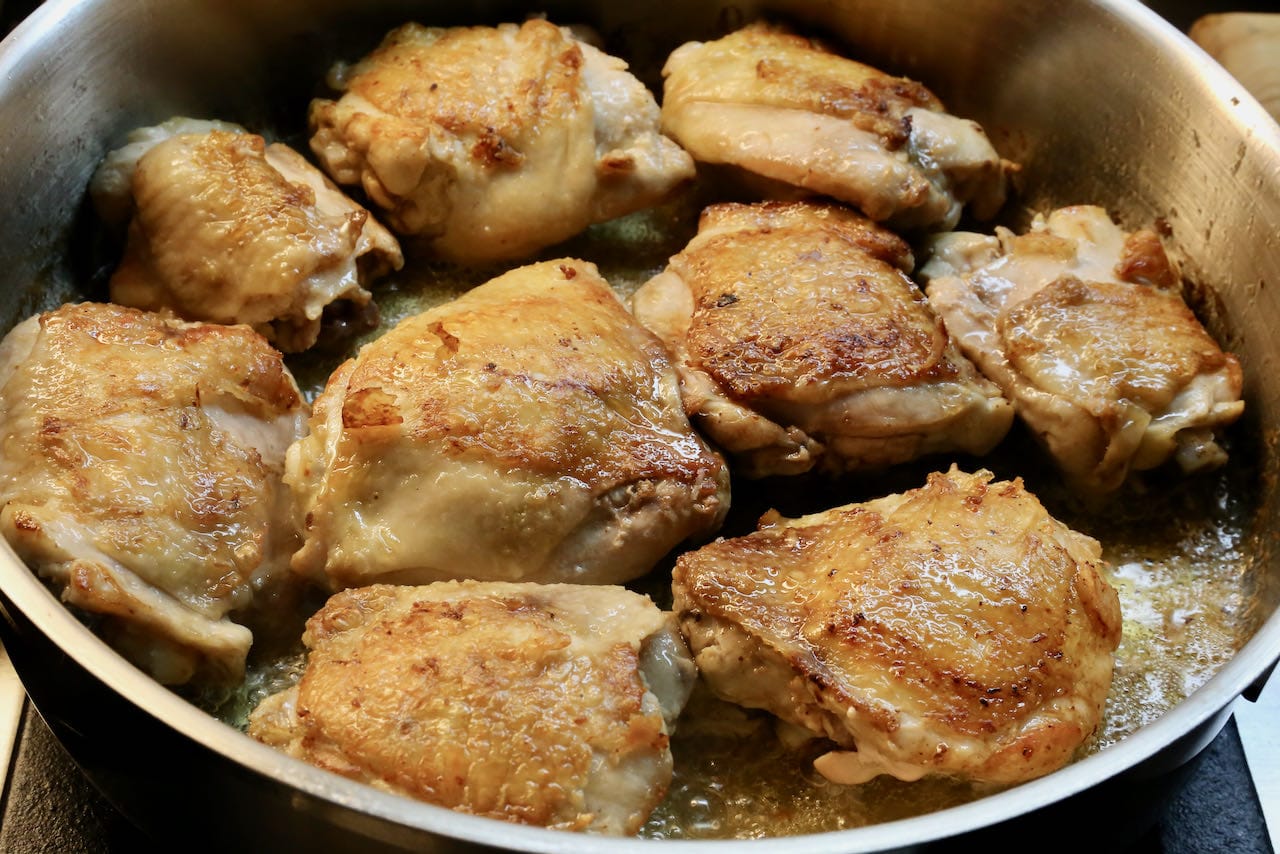 Traditional Paprikas Csirke features crispy pan fried chicken thighs.
