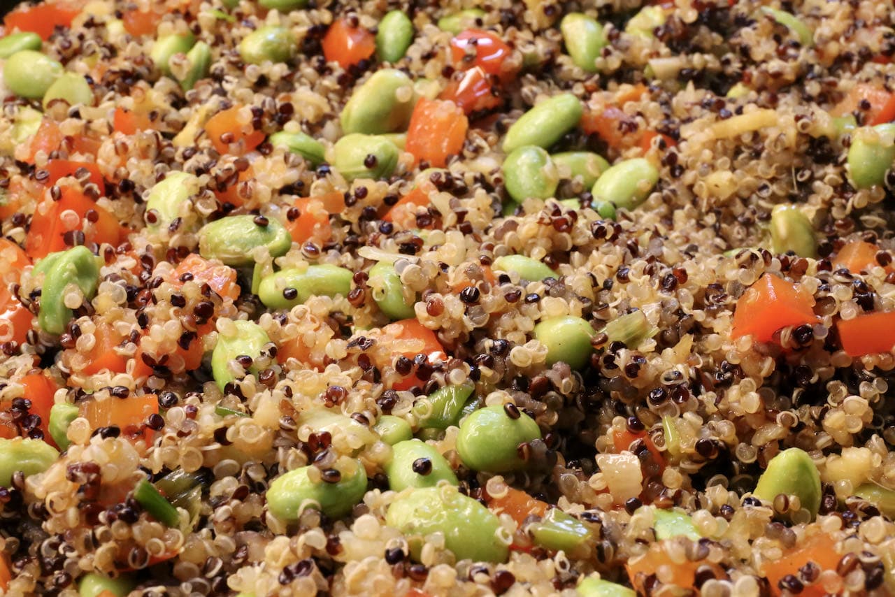 Our Quinoa Chaufa recipe features colourful green edamame, red bell peppers and multicoloured Peruvian grains.