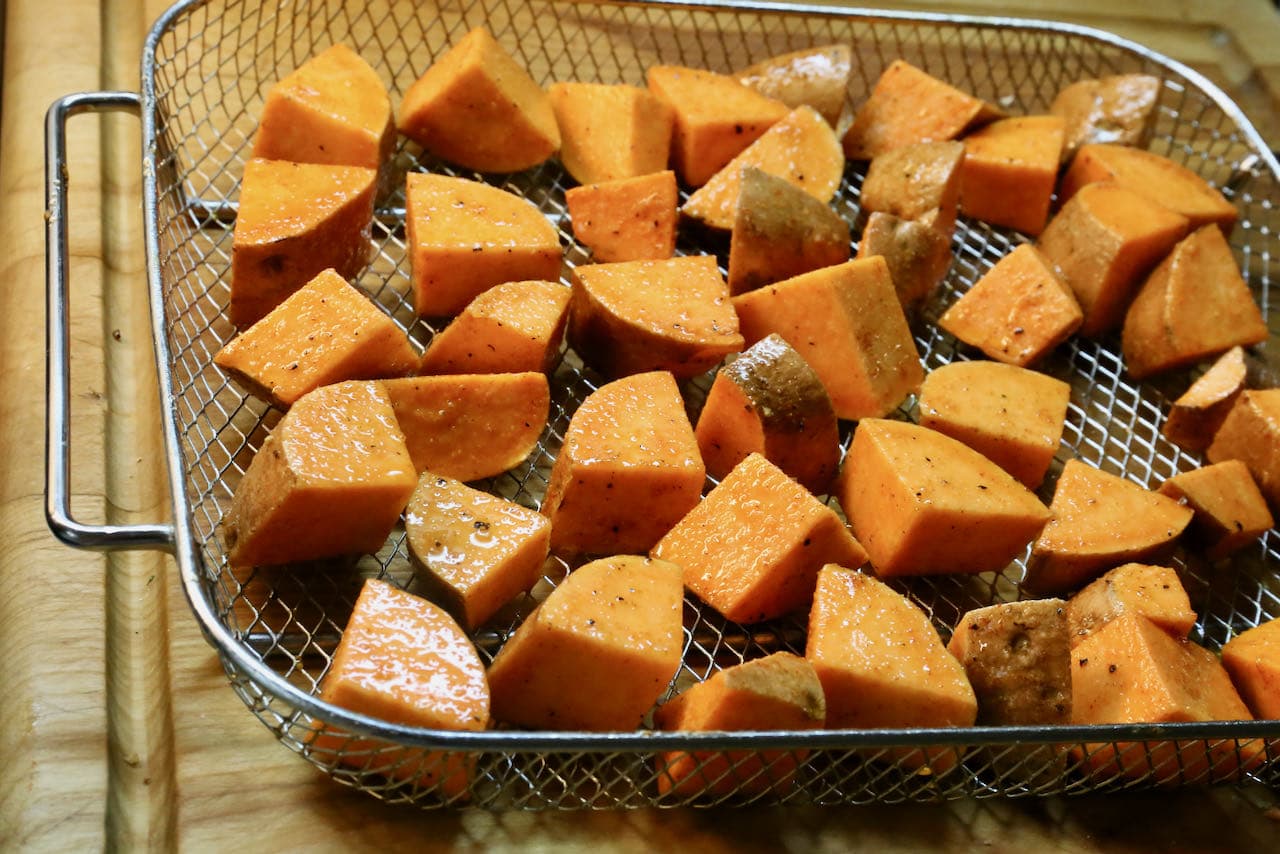 Spread Sweet Potato Cubes and Chunks in the air fryer basket so they don't touch.