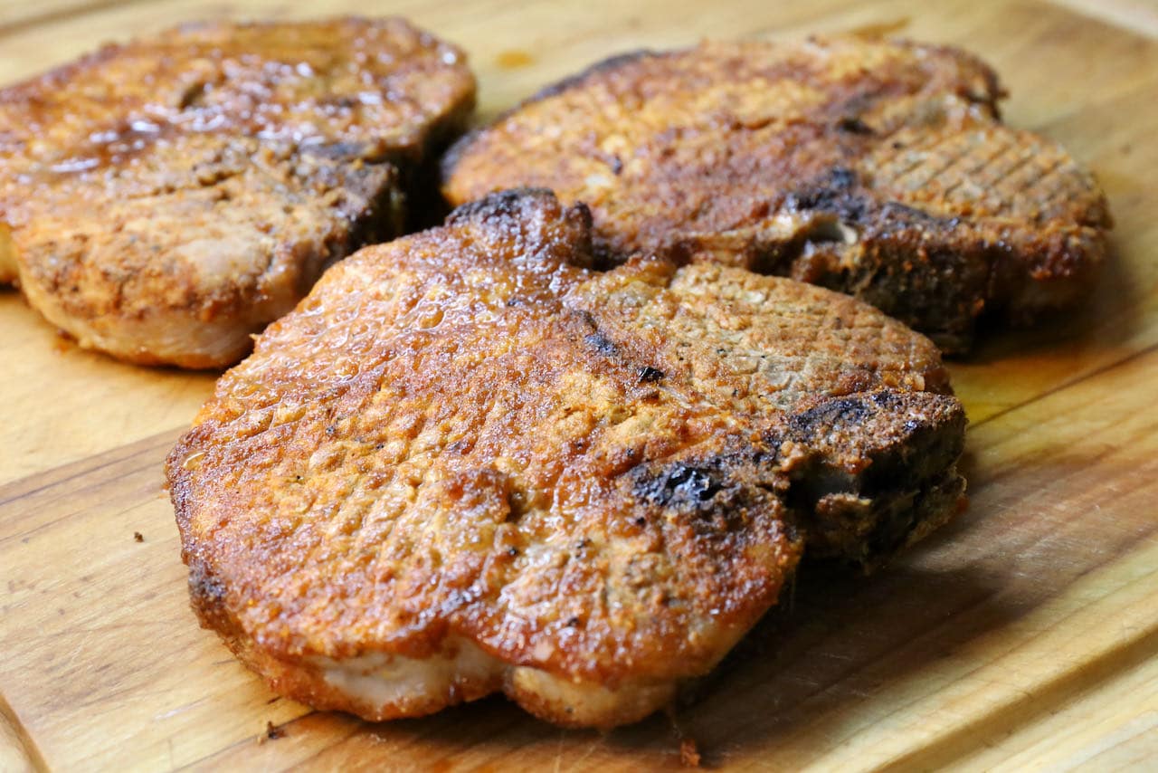 Serve bone in pork chops on individual plates or slice and enjoy on salads or pasta.