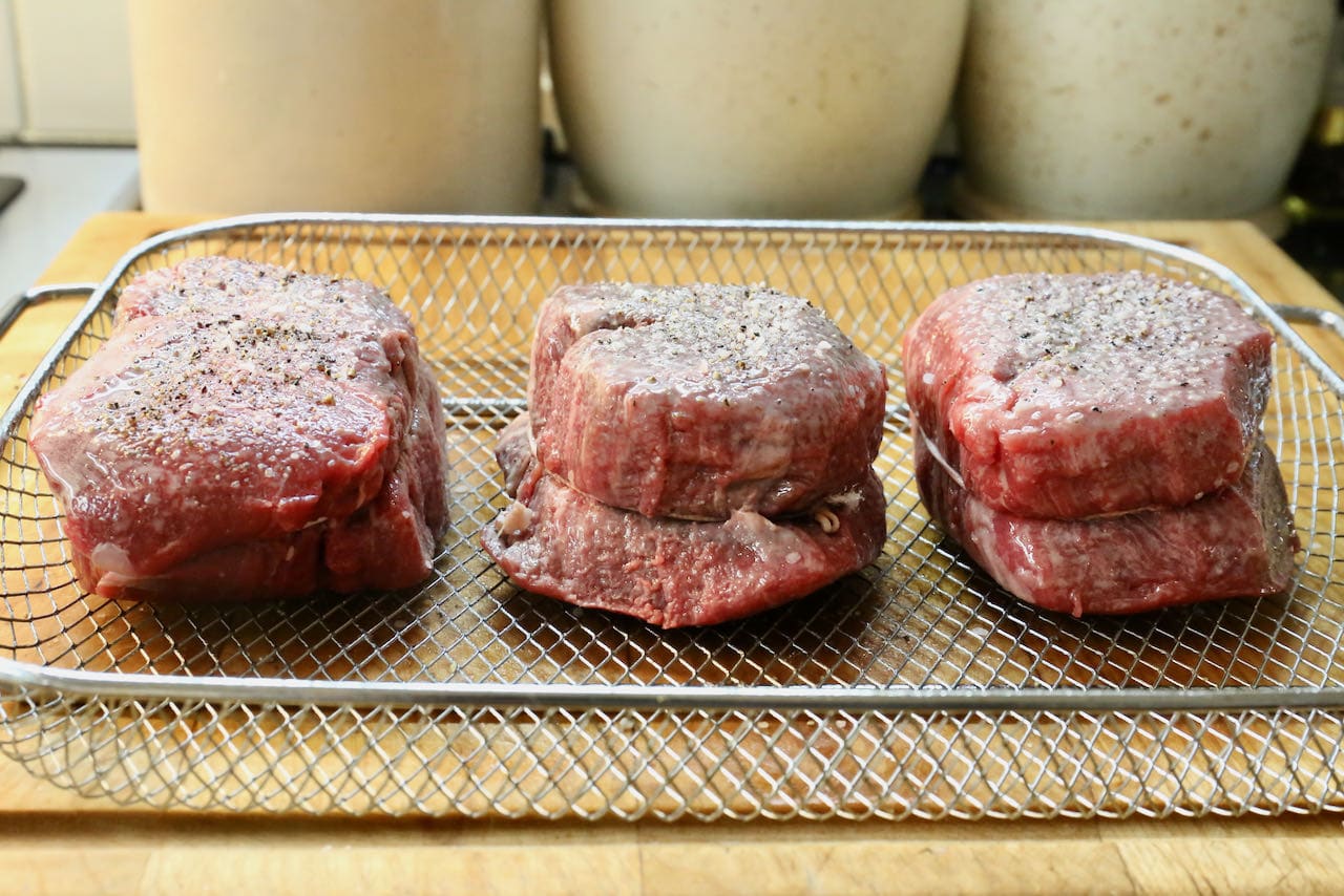 Season with salt and pepper before cooking filet mignon in air fryer. 