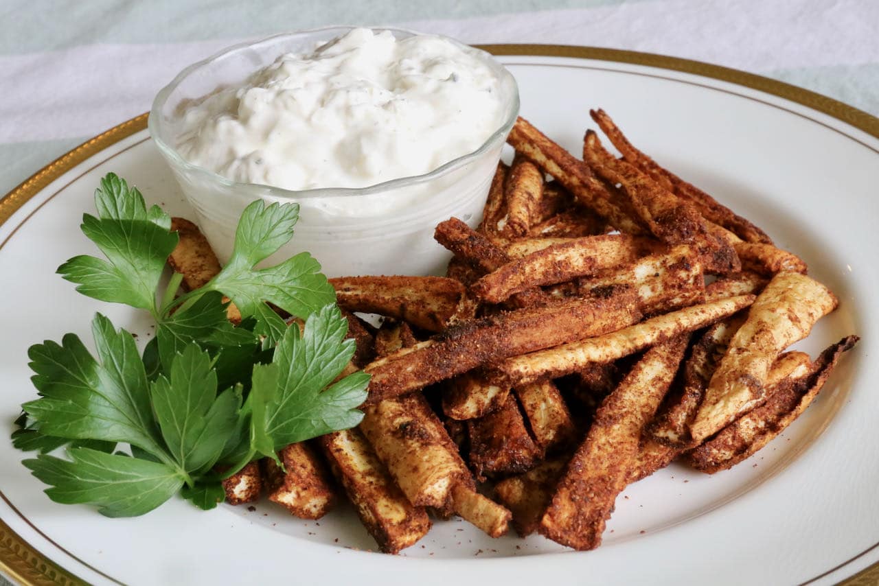 Serve Air Fryer Parsnips with fresh herbs and yogurt or sour cream for dipping.