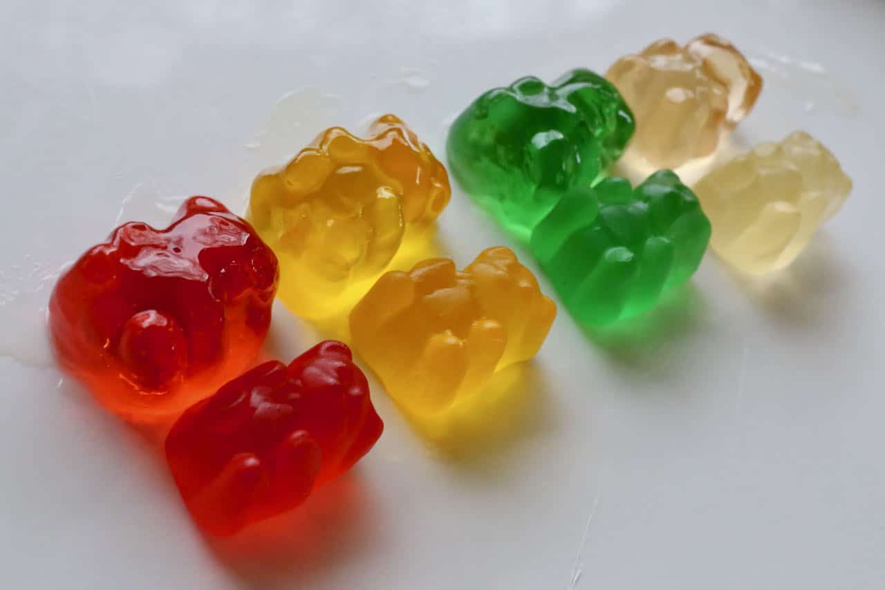 Left: large engorged Alcohol Gummies. Right: original size of gummy bears. 