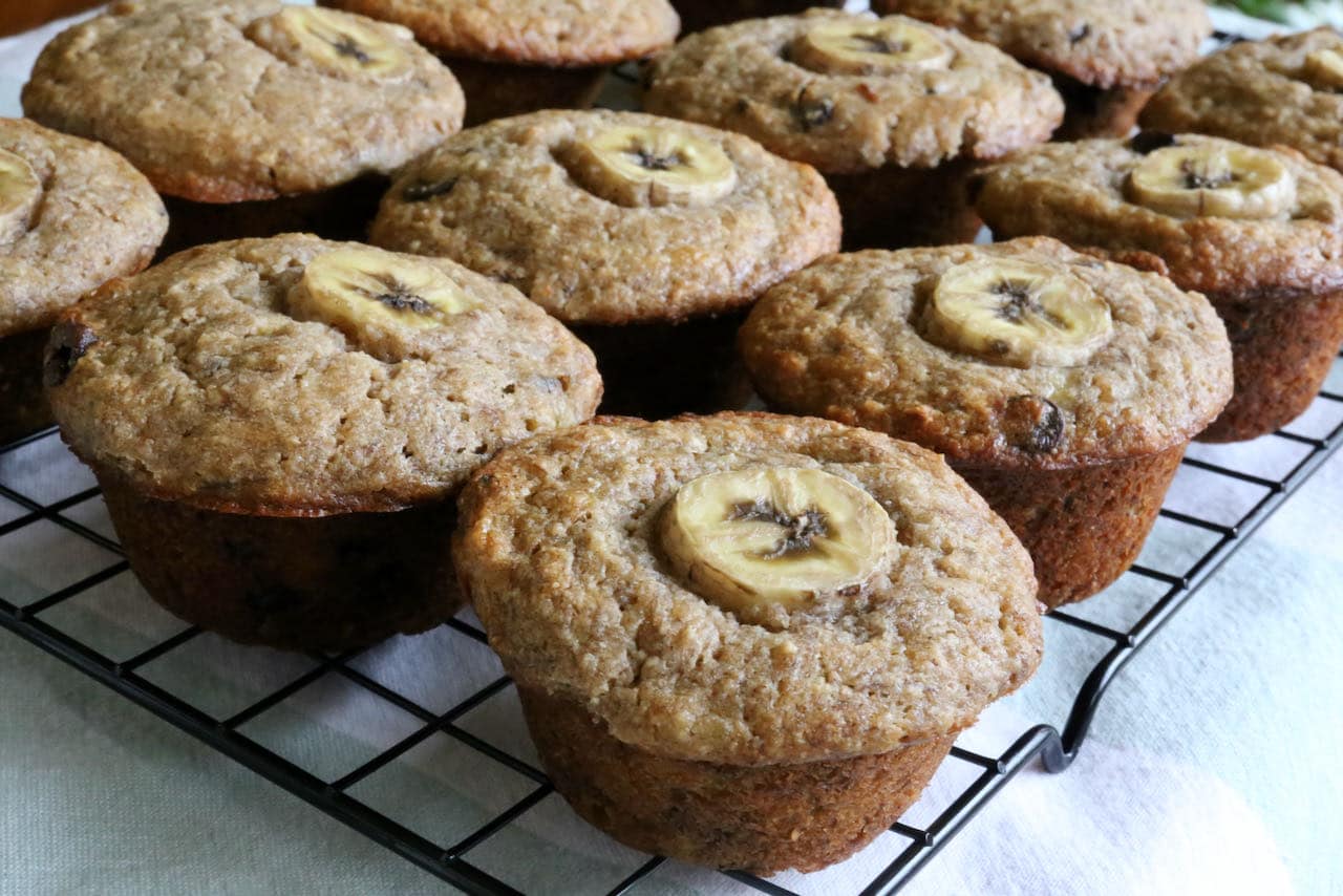 Cool gluten free banana chocolate chip muffins on a rack before serving.