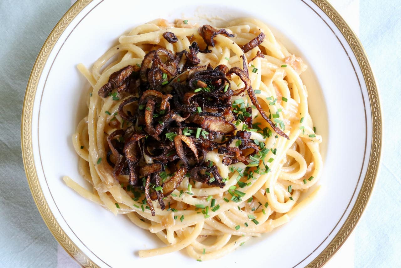 Serve Pasta in Shallot Cream Sauce topped with crispy fried shallots and chopped chives.