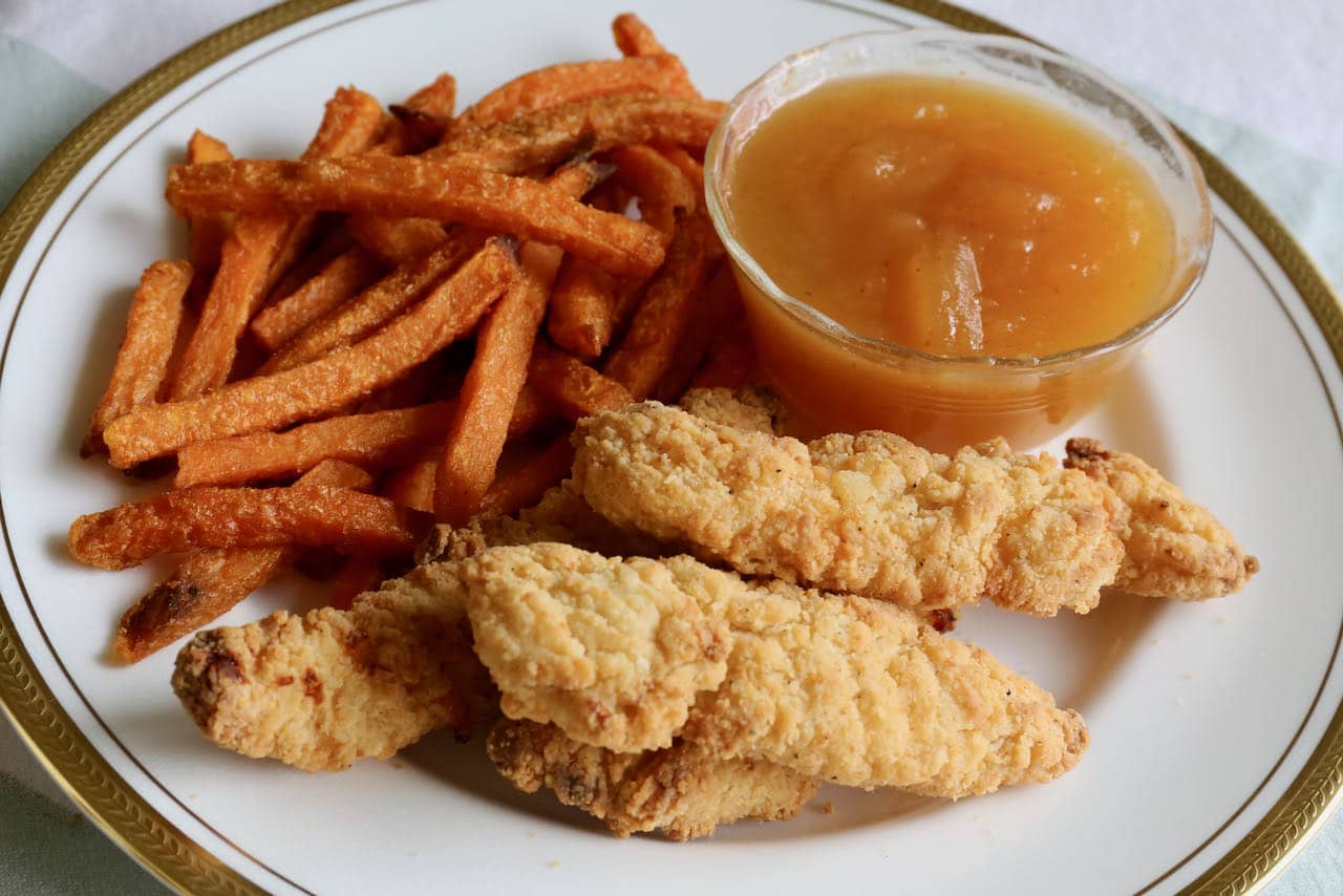 We love serving air fryer frozen chicken fingers with fries and plum sauce.