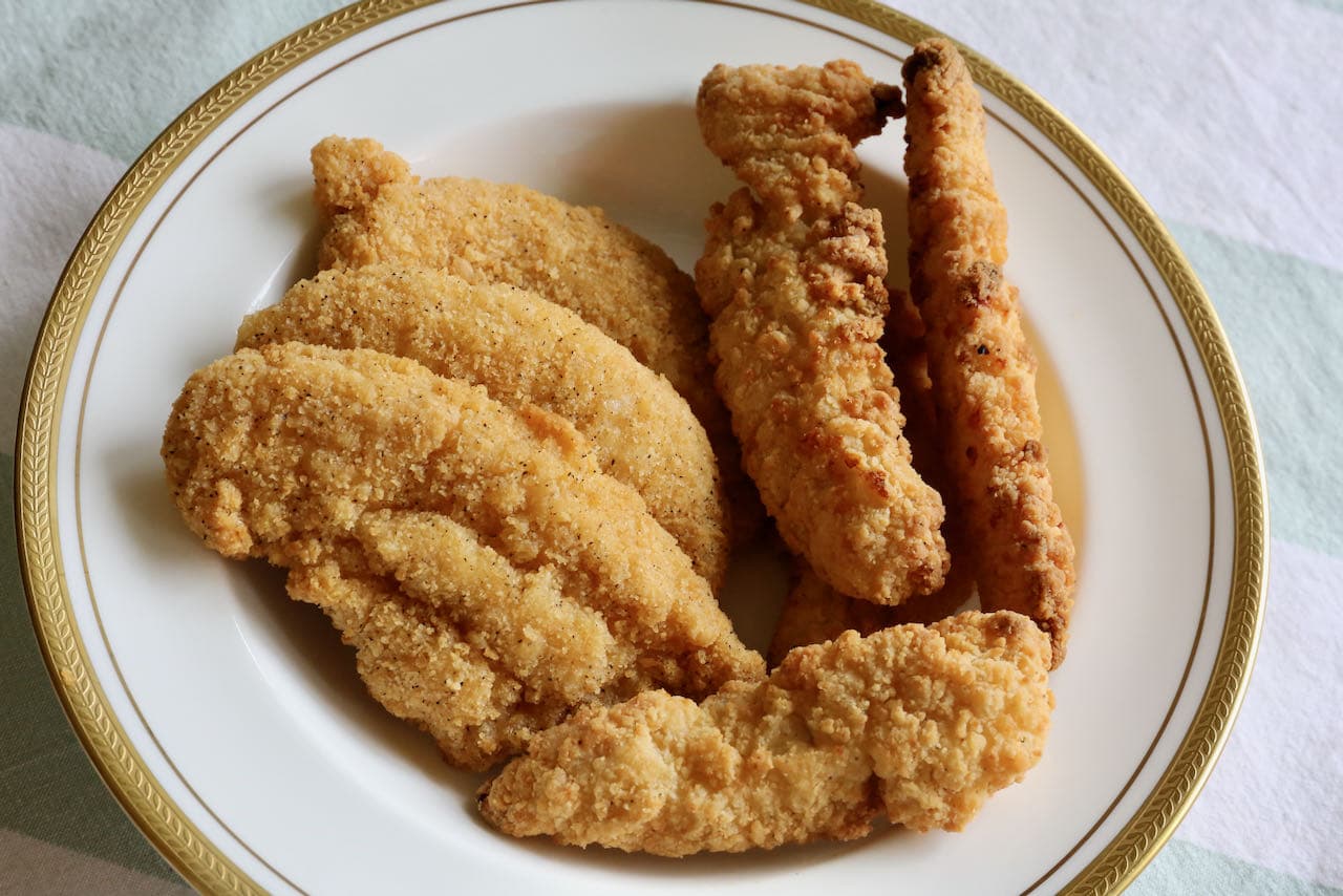 Crispy chicken fingers can be simply enjoyed alone or on top of a fresh salad for a hearty meal. 