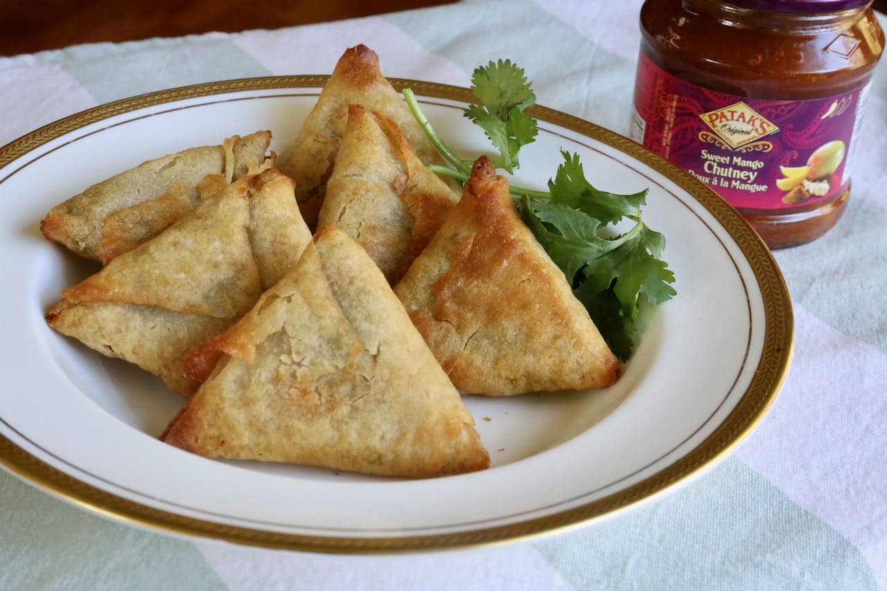 Serve Air Fryer Samosas with cilantro and your favourite Indian chutney.