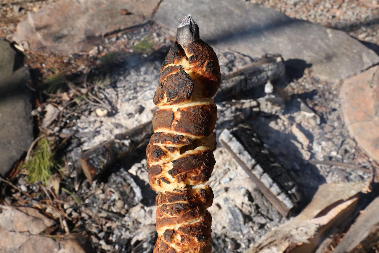 Enjoy dipping campfire bread on a stick in peanut butter, garlic butter or Nutella. 