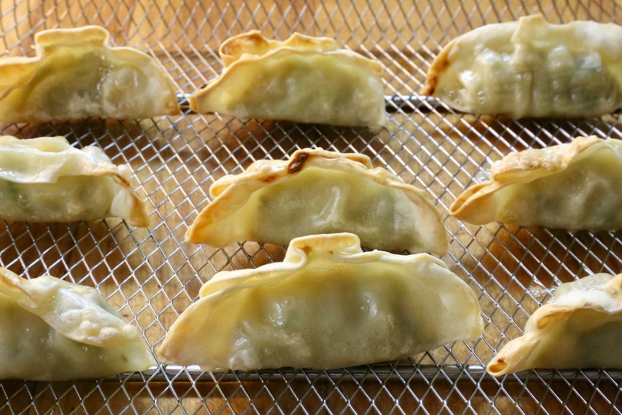 Cook Frozen Air Fryer Dumplings until the exterior is browned and crunchy and interior is warm and tender.