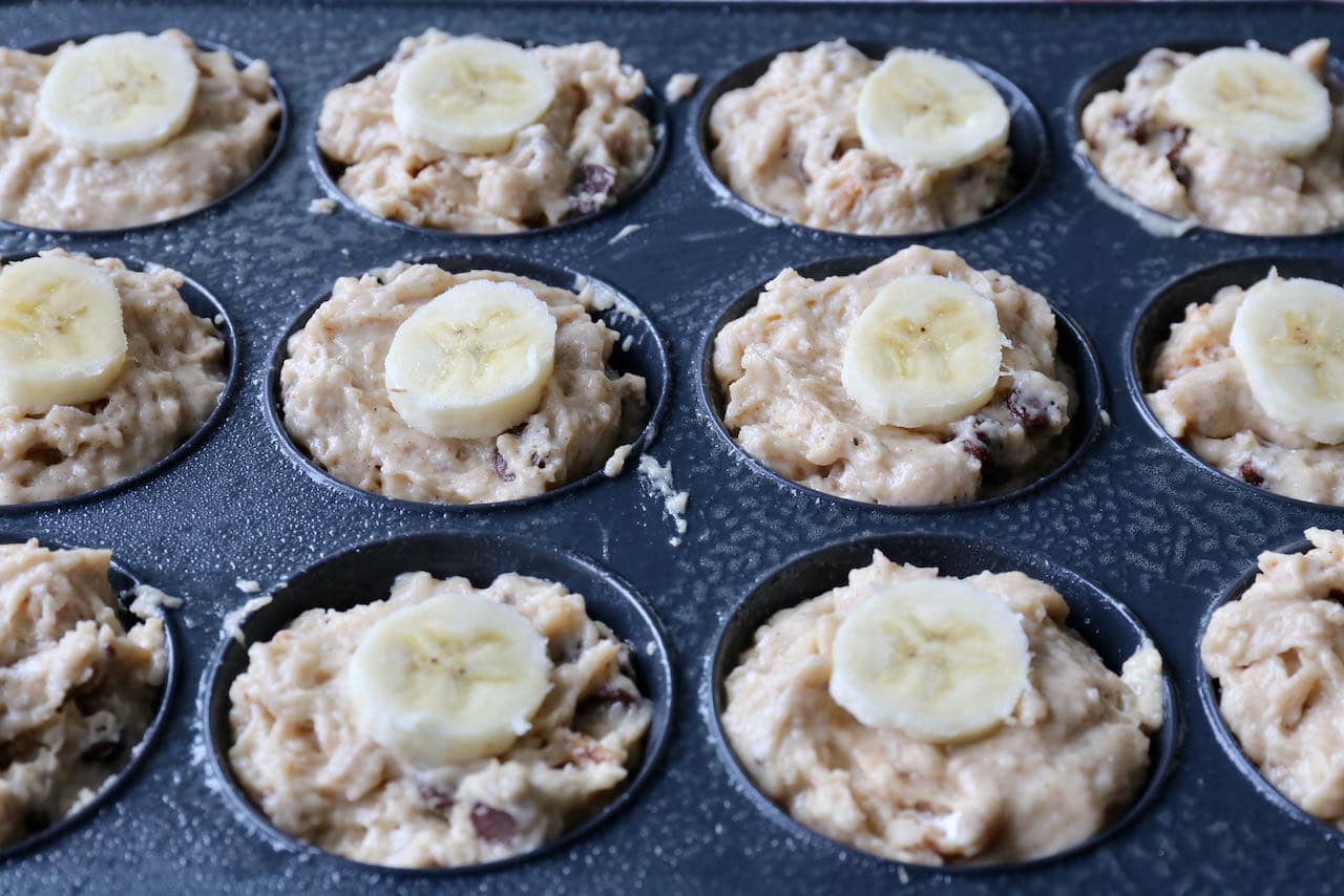 Top each muffin cup with a thin slice of banana.