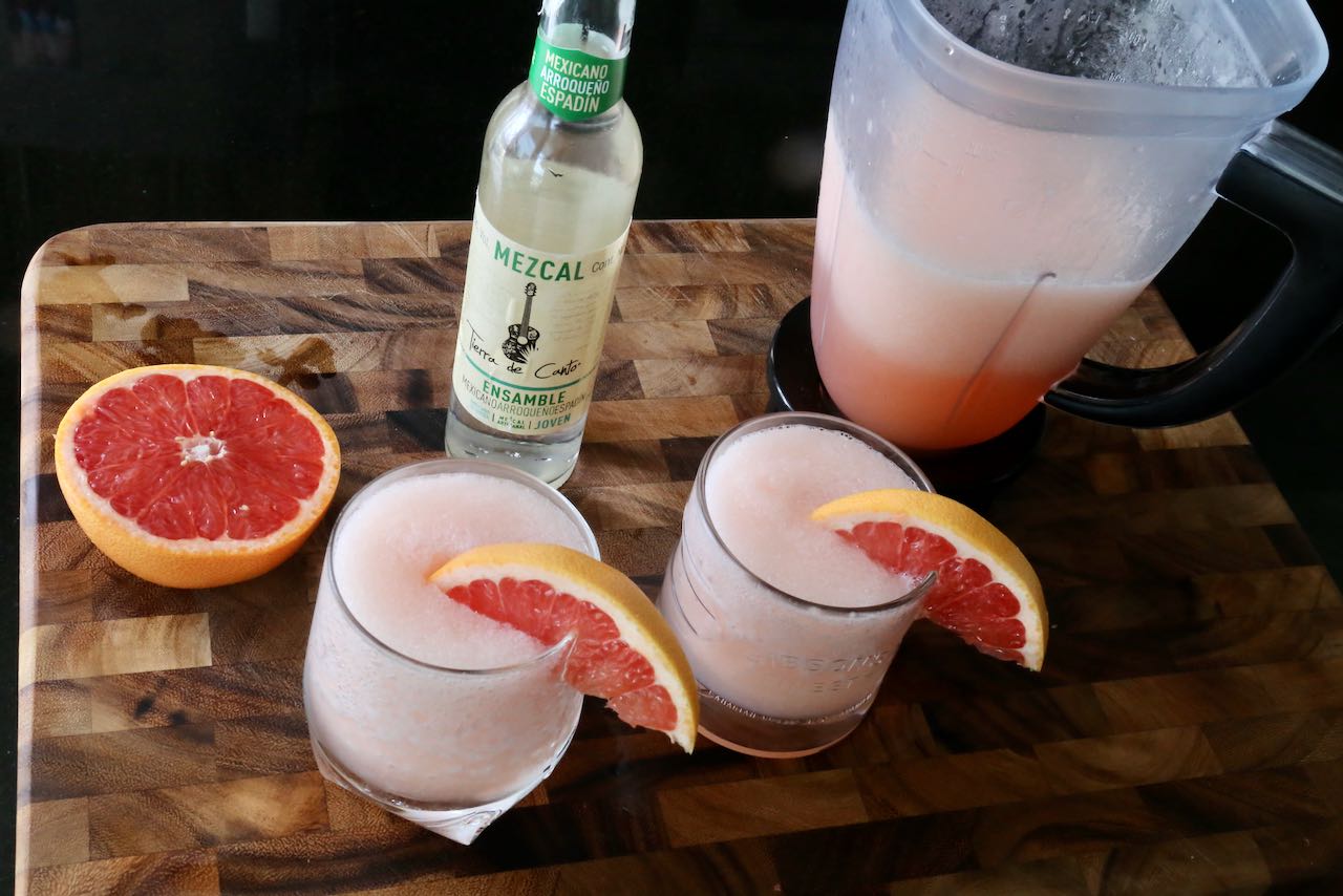 Garnish your Mezcal Paloma cocktails with a fresh slice of grapefruit.