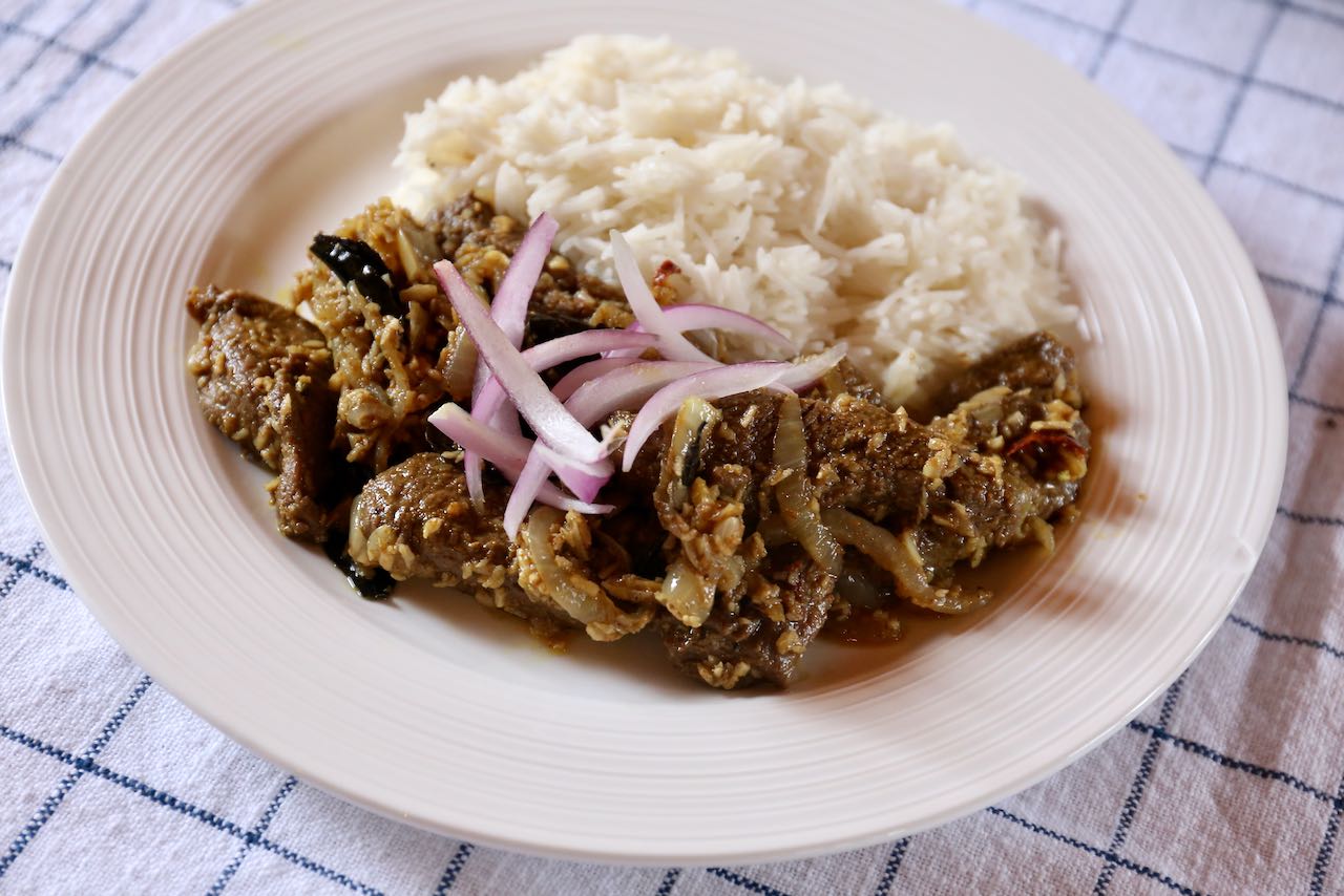 Serve Beef Ularthiyathu with steamed rice or naan bread. 