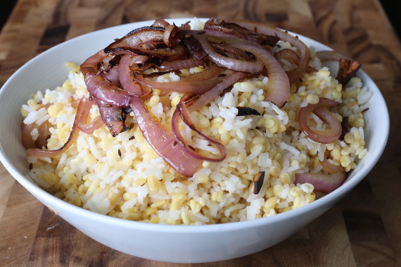 Garnish Kitchri with sweet fried red onions.