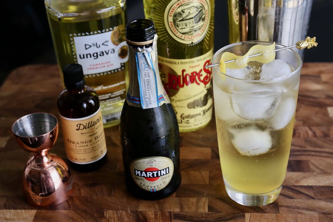 Serve this refreshing Sparkling Saffron Gin Cocktail in a Collins glass over ice.